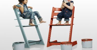 two-wooden-colorful-high-chairs-with-twins-sitting-on